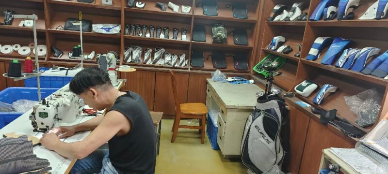 Golf headcover factory production line showing sewing and quality inspection